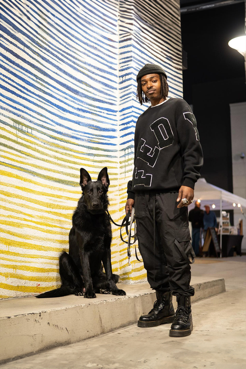 model wearing black chenille crewneck