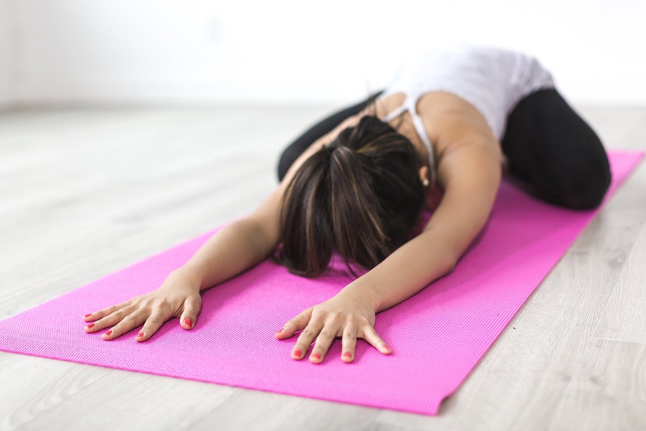 woman stretching in hot yoga pants